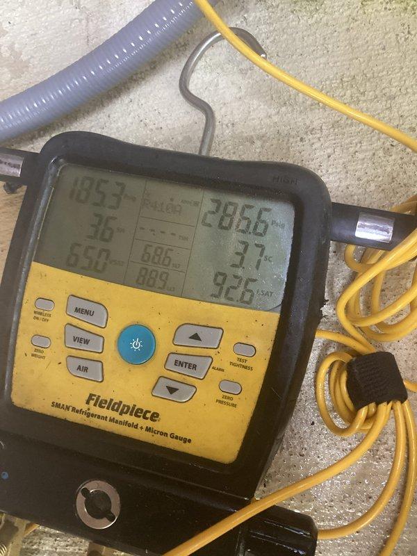 Responded to no cooling complaint on 7-year-old outdoor unit. Upon arrival, connected refrigerant manifold and micron gauge to diagnose system performance. Measured operating temperatures and pressures, recording suction and discharge readings to evaluate refrigerant charge and compressor function. System diagnostics revealed unit was struggling to maintain proper cooling capacity. Advised shutting off humidifier as previously instructed to prevent additional strain on system during cooling season.