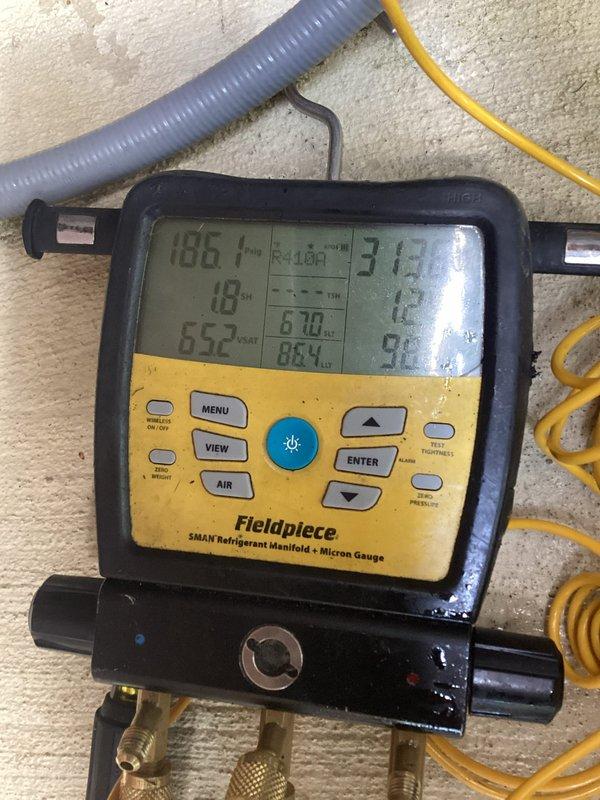 Responded to no cooling complaint on 7-year-old outdoor unit. Upon arrival, connected refrigerant manifold and micron gauge to diagnose system performance. Measured operating temperatures and pressures, recording suction and discharge readings to evaluate refrigerant charge and compressor function. System diagnostics revealed unit was struggling to maintain proper cooling capacity. Advised shutting off humidifier as previously instructed to prevent additional strain on system during cooling season.