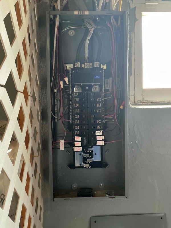 Responded to a no-power service call affecting the living room, bathroom, and second bedroom following a GFCI installation that caused a breaker to trip. Inspected the newly installed GFCI receptacle and verified proper wiring connections and functionality, confirming the green LED indicator showed the device was operational. Accessed the main electrical panel, identified the tripped breaker serving the affected circuits, and reset the breaker to restore power to all three rooms.