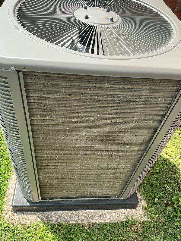 Completed comprehensive cooling tune-up on 3-year-old residential AC system. Condenser coils were heavily clogged with dust, dirt, and debris accumulation, significantly restricting airflow through the unit. Thoroughly cleaned and cleared all exterior coil surfaces, restoring proper ventilation and heat exchange efficiency to manufacturer specifications.
