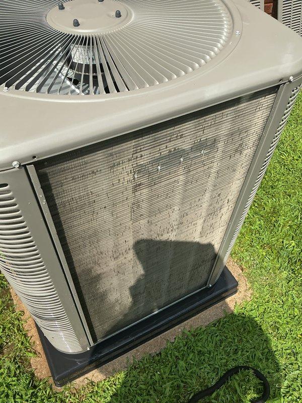 Completed comprehensive cooling tune-up on 3-year-old residential AC system. Condenser coils were heavily clogged with dust, dirt, and debris accumulation, significantly restricting airflow through the unit. Thoroughly cleaned and cleared all exterior coil surfaces, restoring proper ventilation and heat exchange efficiency to manufacturer specifications.