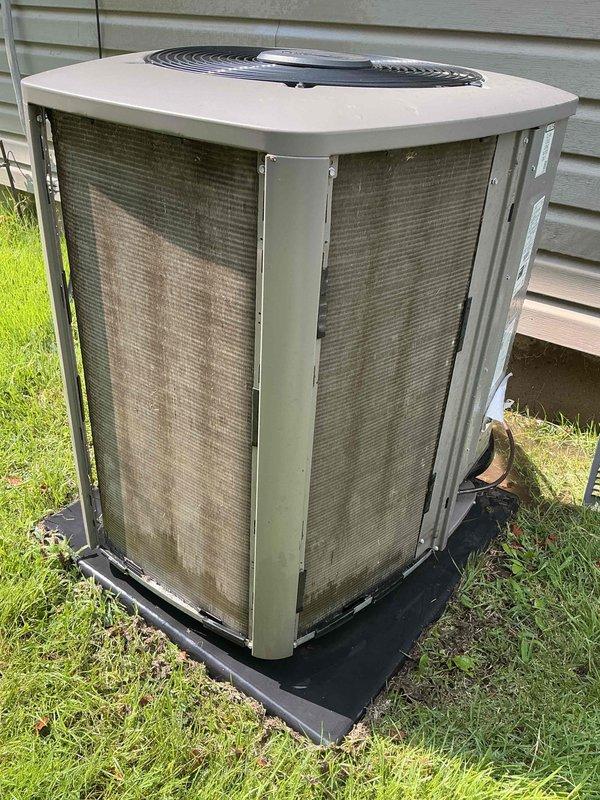 Responded to no cooling complaint on residential air conditioning system less than 10 years old located behind property. Upon arrival, performed diagnostic evaluation of outdoor condenser unit and system operation. Unit showed signs of normal outdoor environmental exposure with weathering on metal grilles and mesh panels. Inspected refrigerant line connections, electrical components, and overall system condition. Advised customer on proper thermostat operation and system settings to achieve desired temperature setpoint. System found to be operational with no mechanical failures identified. Provided guidance on unit maintenance and proper operation procedures.