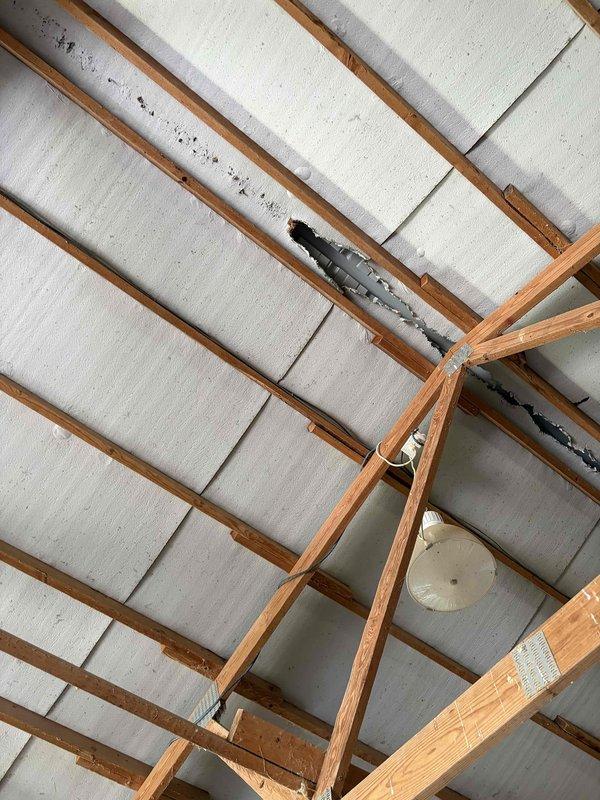 Conducted on-site assessment of barn facility to provide electrical estimate for exhaust fan installation. Evaluated existing ceiling structure, including exposed wooden beams, metal roofing, and current ventilation system with black flexible ductwork. Assessed electrical infrastructure and determined optimal placement for exhaust fan unit to improve air circulation in the agricultural workspace housing livestock and equipment storage areas.