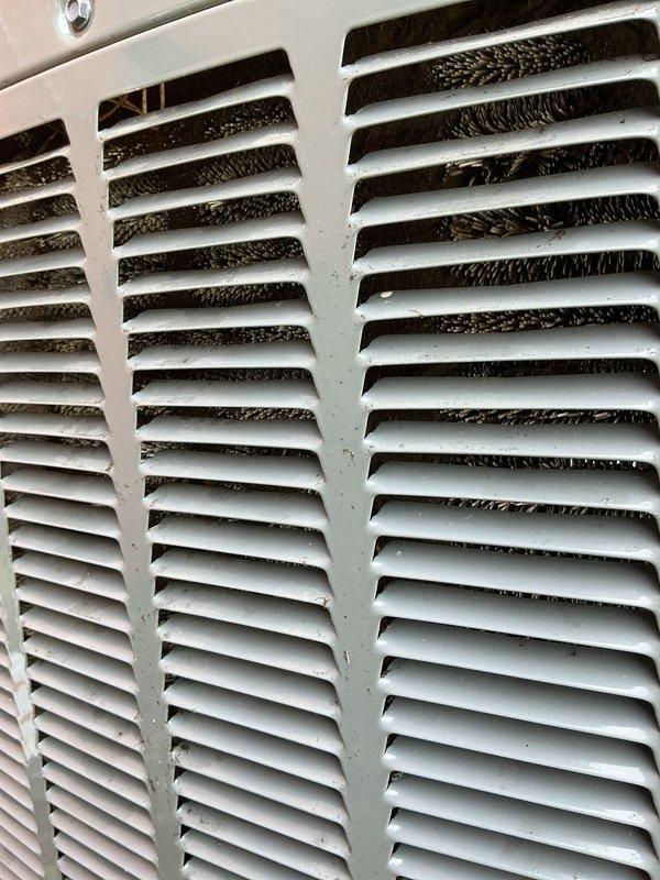 Responded to no cooling call on 9-year-old system with indoor air handler operating but outdoor condensing unit not running. Upon arrival, confirmed indoor blower functioning and return air grille showing significant dust accumulation. Proceeded to outdoor unit and performed electrical diagnostics using multimeter on refrigerant lines and electrical components. Identified failed contactor preventing compressor operation. Replaced defective contactor, restored power, and verified outdoor unit startup with proper amperage draw. System now cooling normally with both indoor and outdoor units operating as designed.