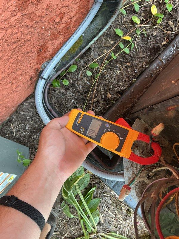 Responded to no cooling call on 9-year-old system with indoor air handler operating but outdoor condensing unit not running. Upon arrival, confirmed indoor blower functioning and return air grille showing significant dust accumulation. Proceeded to outdoor unit and performed electrical diagnostics using multimeter on refrigerant lines and electrical components. Identified failed contactor preventing compressor operation. Replaced defective contactor, restored power, and verified outdoor unit startup with proper amperage draw. System now cooling normally with both indoor and outdoor units operating as designed.