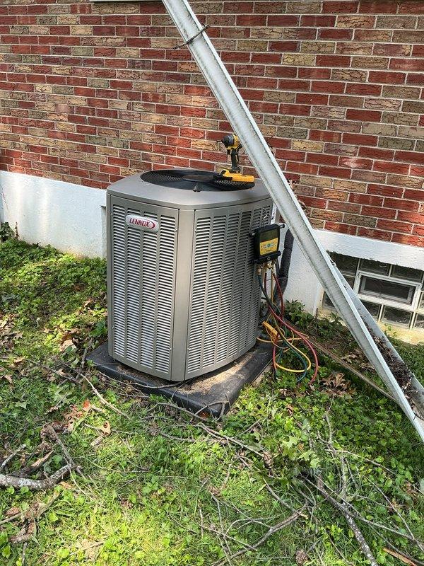 Performed diagnostic inspection on 10-year-old Lennox outdoor condensing unit following reported tree branch impact and power outage. Conducted comprehensive visual examination of cabinet, fan assembly, electrical components, and refrigerant lines. Unit operational with no visible damage to condenser coil, fan motor, compressor, or electrical disconnect; all mechanical and electrical systems functioning within normal parameters.