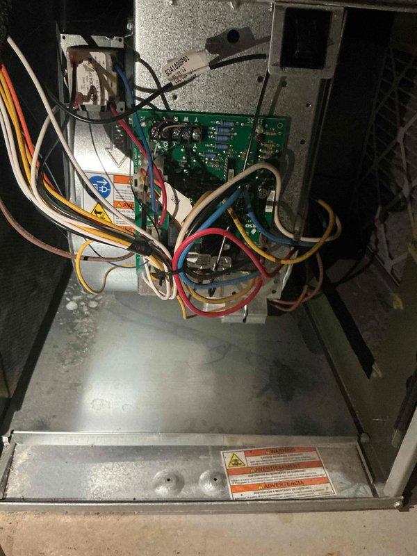 Completed comprehensive cooling tune-up on two HVAC units located at rear of property. Performed standard maintenance procedures including inspection of control boards, electrical connections, and internal components on both systems. All wiring connections verified secure, circuit boards inspected for proper operation, and units confirmed operational with no deficiencies noted.