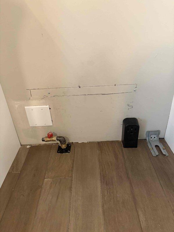 Installed dedicated 240V circuit using 12/4 wire for electric stove connection. Ran new wiring through wall cavities, cut access openings to route conductors, and installed appropriate electrical boxes and connections. Completed installation with proper shutoff and outlet configuration to meet code requirements for kitchen appliance circuit.