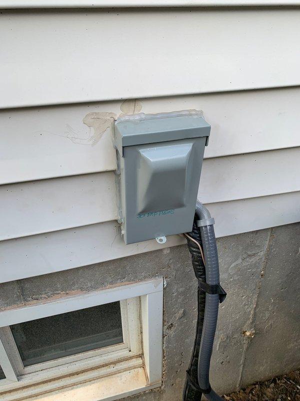 Responded to no cooling complaint on 4-month-old residential air conditioning unit blowing warm air. Upon inspection, found failed contactor preventing compressor operation. Removed defective contactor with burnt contacts and replaced with new component. Verified proper electrical connections at outdoor disconnect, tested system operation, and confirmed unit now cooling properly under first-year warranty coverage.