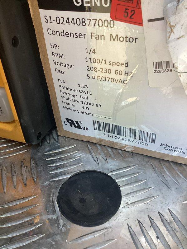 Replaced failed condenser fan motor with new 1/4 HP, 1100 RPM unit rated for 208-230V operation with 5µF capacitor. Removed and disposed of defective motor, installed replacement on condenser unit featuring ball bearings, CWLE rotation, and 48Y frame configuration, restoring proper airflow across condenser coils which showed signs of oxidation and weathering.