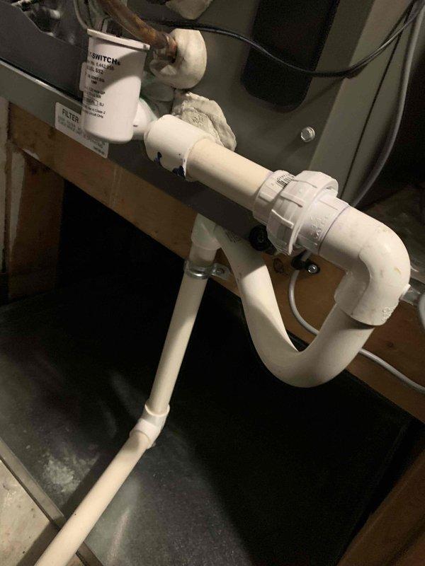 Responded to callback for 3-year-old Lennox AC system with complete loss of cooling affecting entire home. Unit had been previously serviced in June but issue recurred. Upon arrival, performed comprehensive system diagnostics including electrical checks at service panel, inspected refrigerant lines and condensate drainage system in basement utility area. Verified proper P-trap configuration and drain line functionality to ensure no secondary issues affecting system operation. Documented equipment conditions and installation components with photos for warranty and service history records. System restored to full operational status with cooling confirmed throughout home.
