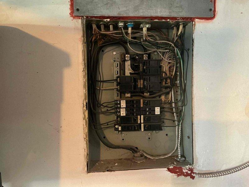Conducted on-site evaluation for electric vehicle charging station installation in residential garage. Assessed existing electrical panel capacity and condition, documenting current breaker configuration and available circuits to determine infrastructure requirements for Level 2 EV charger installation. Provided comprehensive estimate for potential panel upgrade and dedicated 240V circuit installation to support car charging equipment.