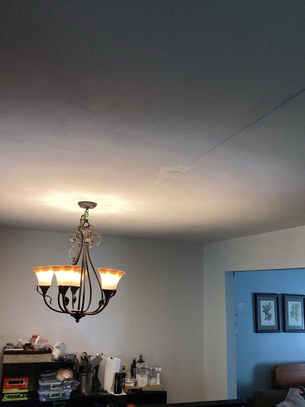 Completed electrical estimate for kitchen and great room area requiring installation of recessed lighting fixtures in ceiling and relocation of existing stove circuit. Assessment revealed ceiling damage present in work area that will need to be addressed prior to final electrical installation. Provided detailed estimate for wiring new recessed can lights throughout ceiling space and relocating 240V range circuit to new position per specifications.