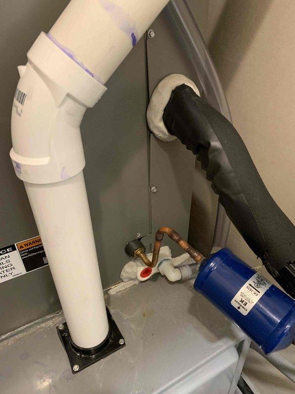 Responded to callback for upstairs AC unit with ongoing water discharge issue after previous service attempts. Upon inspection, found heavily soiled evaporator coil and condensate drain system requiring attention. Cleaned accumulated dust and debris from unit components, cleared condensate line blockage causing water overflow down equipment, verified proper drainage flow, and tested system operation to ensure issue resolution.