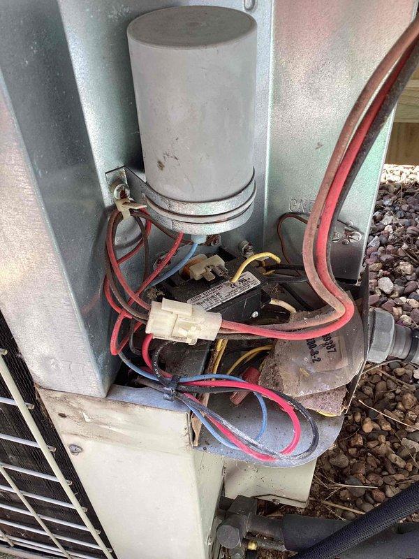 Responded to no-cool call with reported hissing sound on 28-year-old outdoor unit. Upon arrival, customer had already shut off system as previously advised. Performed diagnostic inspection of outdoor unit, checked thermostat operation showing 80°F reading, and examined electrical components including capacitor and contactor assembly. Documented system condition with photos of thermostat and electrical compartment showing aged wiring and weathered components typical of unit's age.