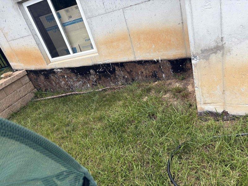 Conducted comprehensive site assessment for standby generator installation. Evaluated existing electrical service panel containing multiple circuit breakers with main disconnect and documented current electrical infrastructure configuration. Assessed exterior foundation area and identified optimal generator placement location considering drainage conditions, foundation access, and utility clearances. Documented site conditions including moisture patterns near foundation and existing electrical service capacity. Prepared detailed estimate for complete automatic transfer switch installation, generator pad preparation, fuel line connection, and integration with existing electrical system. Evaluation included load calculation requirements and transfer switch specifications necessary for seamless emergency power transition.