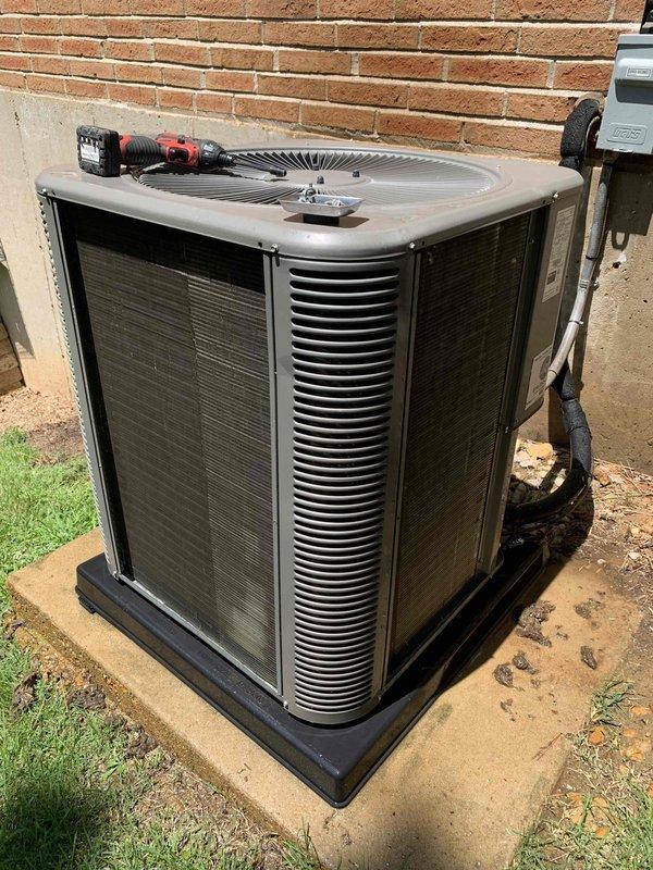 Responded to service call for rattling noise coming from 10-year-old basement air conditioning unit. Upon arrival, inspected outdoor condenser unit and found heavy accumulation of dirt and debris on front panel and internal components. Removed access panel and thoroughly cleaned condenser coils, fan assembly, and housing. Identified loose mounting hardware on blower fan causing vibration and rattling noise audible through ductwork. Tightened all fasteners and secured fan assembly. Cycled system through multiple operation cycles to verify elimination of rattling noise. Unit operating properly with normal airflow and cooling capacity restored.