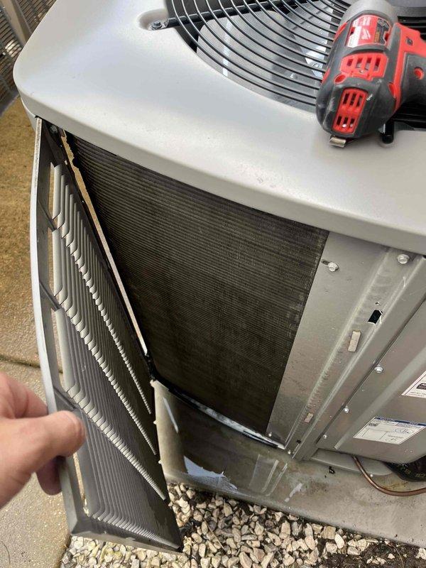 Completed comprehensive cooling season tune-up on 3-year-old outdoor condensing unit. Performed full system inspection including amperage draw verification using clamp meter (reading 9.82A), accessed and inspected condenser coil condition through side panel, and evaluated fan motor operation. All components found operating within normal parameters with no deficiencies noted.
