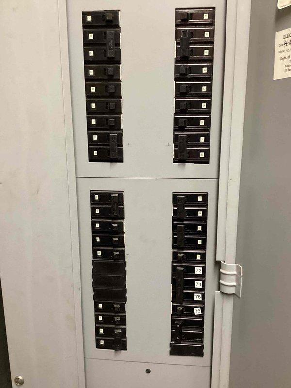 Provided electrical estimate for installation of dedicated circuit to support mini split system. Assessed existing electrical panel capacity and determined routing requirements through utility/mechanical space. Evaluated panel configuration showing adequate breaker positions available and confirmed compatibility for new circuit installation to accommodate mini split unit power requirements.