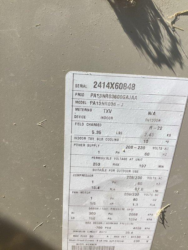 Responded to no cooling complaint on 12-year-old R-22 system. Upon arrival, performed diagnostic evaluation of outdoor unit, a Goodman PAT3NRO36-J 3-ton condensing unit operating on 208-230V single-phase power. Inspected dual-run capacitor rated at 50+5 MFD 370V, checked all electrical connections at compressor and condenser fan motor terminals, and verified unit nameplate specifications including 16.4 RLA compressor rating and 1/6 HP fan motor. Documented system conditions with photos of equipment data plate and capacitor wiring configuration for service records.