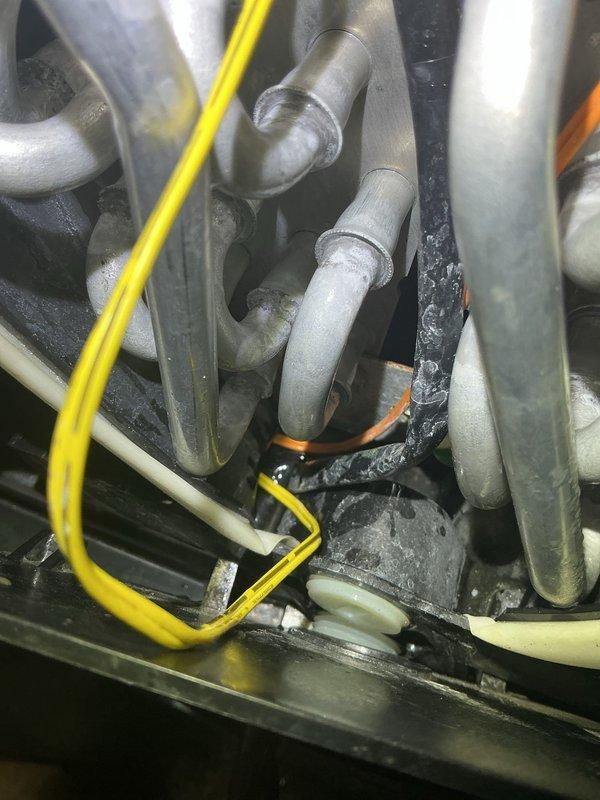 Returned to address unit malfunction following previous service visit. Diagnosed failed sensors, wiring harness, and transducer requiring replacement. All five replacement parts were confirmed under warranty and ordered for delivery to the service location. Documented existing wiring connections and refrigerant line configuration with photographs for reference during parts installation. Unit remains non-operational pending arrival of warranty components. Will schedule follow-up appointment to install sensors, harness, and transducer once parts are received.