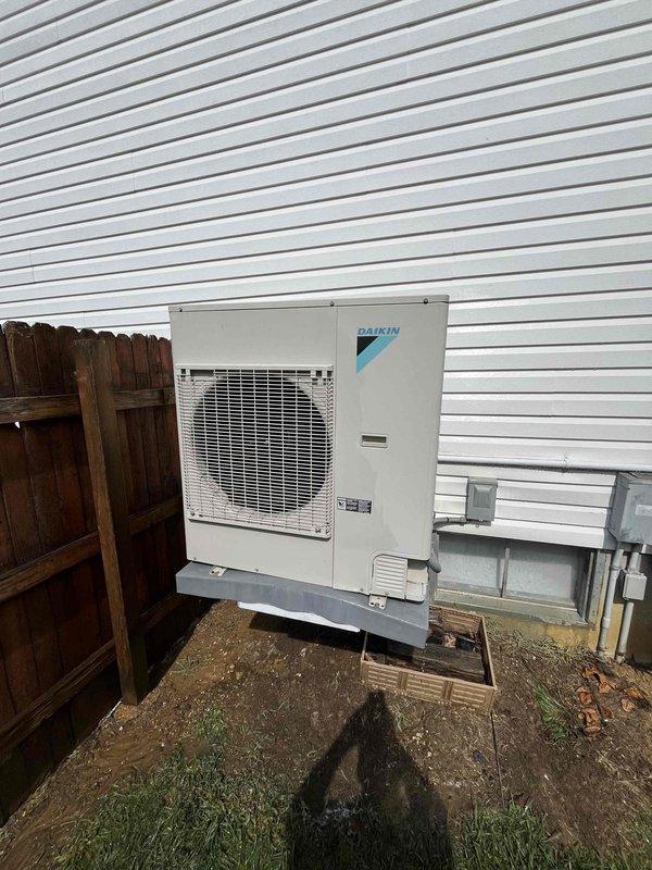 Responded to service call regarding excessive condensation issues on residential Daikin air conditioning system. Upon arrival, inspected outdoor condenser unit and elevated wall-mounted air handler for condensate drainage problems. Customer reported previous mold growth due to ongoing moisture accumulation and expressed concern about potential property damage. Performed thorough examination of condensate drain line, drain pan, and drainage system components. Cleared blockage in condensate line and verified proper drainage flow. Checked refrigerant levels, airflow, and system operation to ensure no additional factors contributing to excess condensation. Confirmed unit cycling properly and condensate now draining as designed. Advised customer on preventative maintenance to avoid future drainage issues. System restored to normal operation with proper moisture management.