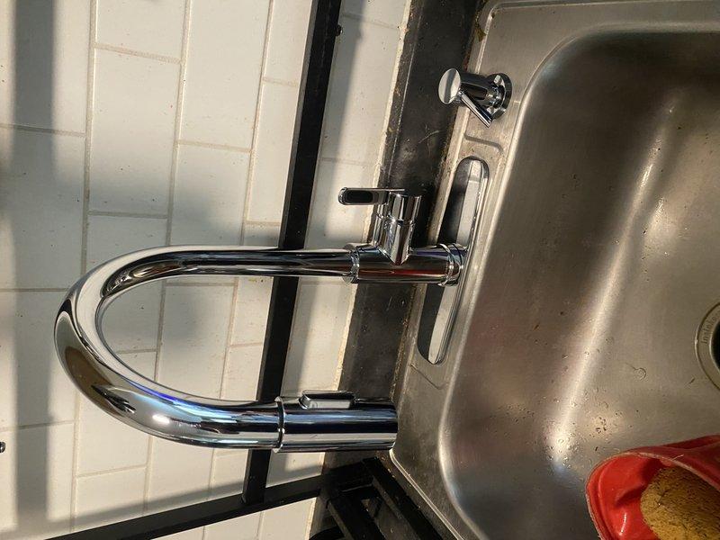 Responded to callback regarding low water pressure at bathroom and kitchen sinks following 50-gallon gas water heater installation. Inspected kitchen sink fixtures, faucet aerators, and supply lines to diagnose pressure loss issue. Verified water heater installation parameters and restored proper water pressure to all affected fixtures throughout the residence.