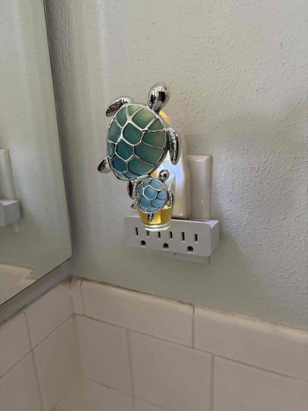 Completed electrical installation of new breaker and outlets per approved estimate. Installed standard duplex receptacles in multiple locations throughout the residence, including bathroom/kitchen area with subway tile backsplash and bedroom area with gray walls. All outlets were properly wired, tested for correct polarity and grounding, and verified operational. Work included running appropriate 12-4 wire circuit as specified, connecting to new breaker in main electrical panel, and ensuring all installations meet current NEC code requirements.