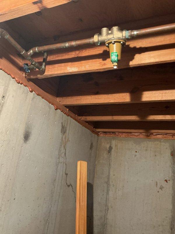 Installed 40-gallon gas tall water heater in basement to replace existing unit that was producing loud booming noises indicative of sediment buildup. Installation included new 3/4" pressure reducing valve to regulate incoming water pressure and prevent future tank stress. Permit #26PLU-14635 applied and all work completed to code specifications with proper venting, gas connections, and safety controls verified operational.