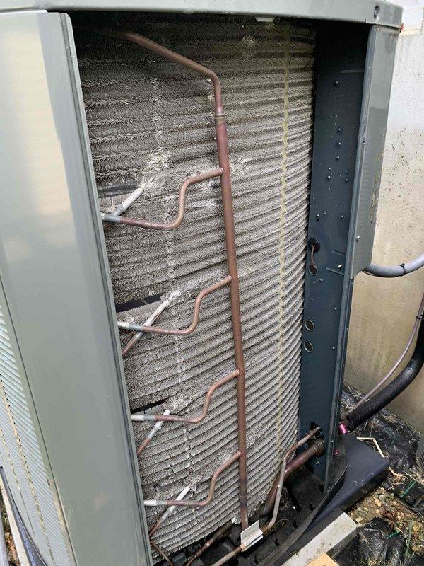 Responded to no heat call and performed comprehensive inspection of 8-year-old Trane furnace system that was reported to shake during operation following recent home inspection findings. Conducted thorough visual and operational assessment of heating unit and associated components.

Inspected evaporator coil assembly and found significant dust and debris accumulation on coil fins, which can restrict airflow and contribute to system vibration and reduced efficiency. Examined copper refrigerant lines throughout the system, noting normal aging and oxidation consistent with unit age. Verified all refrigerant line connections and routing for proper installation and secure mounting.

Evaluated heat exchanger surfaces and found moderate dust buildup on aluminum fins, particularly in upper sections, with some areas showing environmental contamination. Checked unit mounting and cabinet integrity to identify potential sources of vibration during operation. Inspected electrical connections and wi
