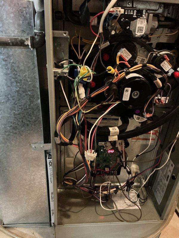 Responded to service call for furnace with air filter access issue stemming from improper 2018 installation. Upon inspection, identified and removed obstructing screw from air handler cabinet that was preventing filter door from opening correctly. Corrected cabinet panel alignment and verified proper clearance for filter removal and replacement. Inspected internal components including blower motors, control board, and wiring harness—all found in satisfactory operating condition with no signs of damage or excessive wear. Noted significant dust accumulation on existing filter, which was addressed. Tested filter door operation multiple times to ensure smooth access for future maintenance. System operational and filter access fully restored.