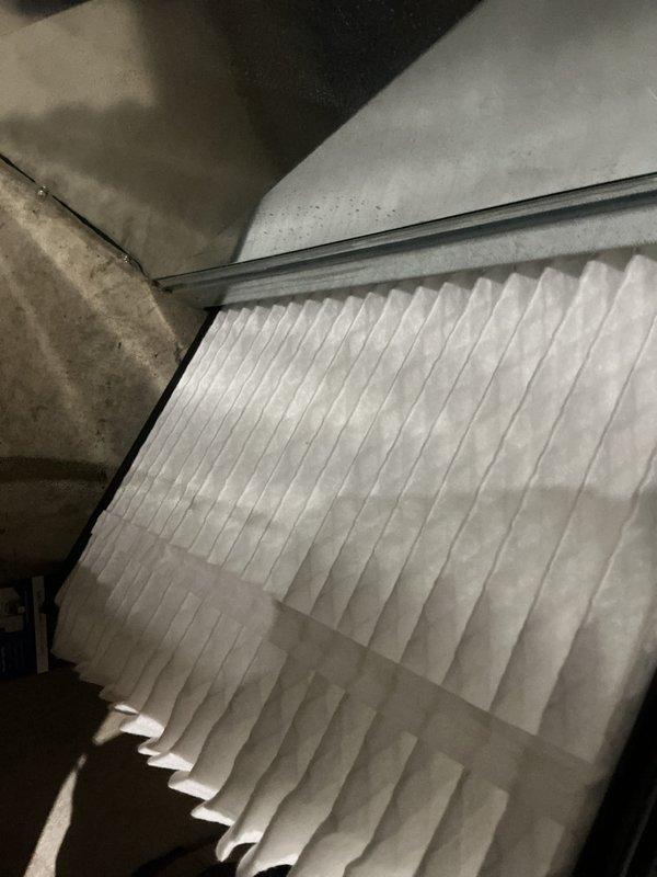 Completed routine cooling system tune-up on a 6-year-old residential air conditioning unit operating within normal parameters. Performed comprehensive maintenance including inspection of blower assembly and motor components, verified proper airflow through clean pleated air filter installed in ductwork, and confirmed all mechanical systems functioning correctly with no deficiencies identified.
