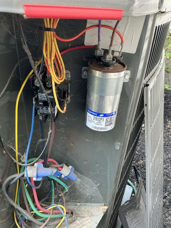 Responded to no-cool call at property being prepared for sale. Upon arrival, inspected outdoor condensing unit and found failed dual-run capacitor preventing compressor and condenser fan operation. Replaced defective capacitor with proper rated replacement, restored power, and verified system startup with normal amperage draws on both compressor and fan motor. Unit cooling properly at time of departure.