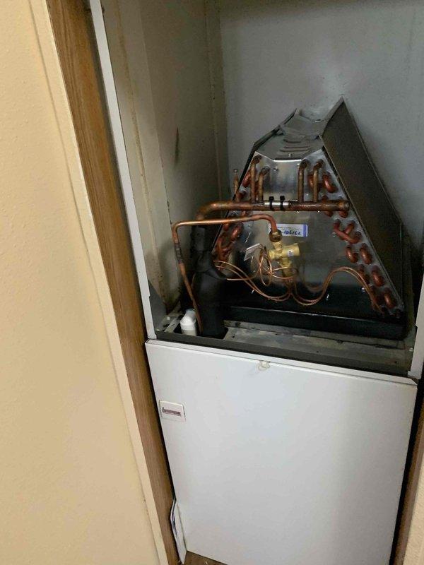 Replaced failed evaporator coil on residential air handler system installed in utility closet. Removed old coil, installed new replacement unit, reconnected refrigerant lines and electrical connections, and verified proper operation of heating and cooling functions. Disposed of defective coil per standard procedures.