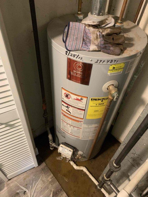 Responded to a backup at the utility room floor drain. Upon arrival, found standing water with sediment and debris covering the floor area near the water heater and plumbing connections. Cleared the clogged floor drain to restore proper drainage and prevent further flooding in the utility space.