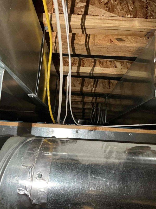 Responded to no cooling complaint on Unit 10 located at ground level on side of home. Upon arrival, performed system diagnostics and inspection of outdoor condensing unit and indoor air handler components. Evaluated electrical connections, refrigerant pressures, and airflow through the system. Inspected ductwork in attic space and verified proper routing of utilities including electrical conduit and refrigerant lines. Checked air handler plenum and return air pathways for obstructions or restrictions. System found to be operating within normal parameters after thorough evaluation. Provided customer with findings and recommendations for optimal system performance.