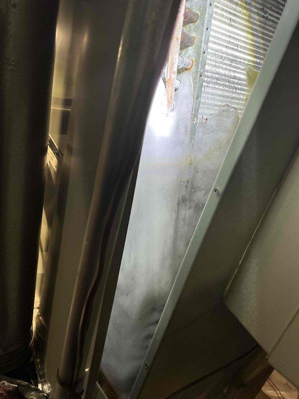 Responded to no cooling complaint on ground-level unit U10. Upon inspection, advised customer to shut off air conditioning system immediately and operate only the fan mode to prevent potential compressor damage. Documented equipment condition with photos showing air handler assembly, evaporator coil with visible dust accumulation, and associated ductwork in utility space.