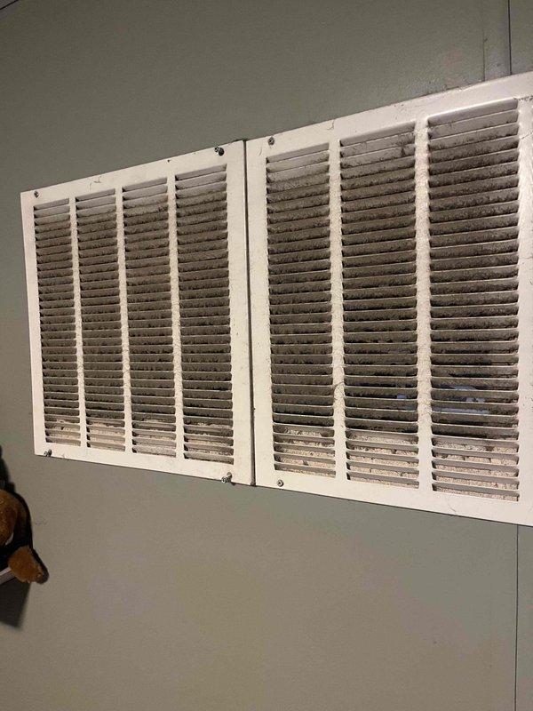 Responded to no-cool complaint on residential cooling system less than 10 years old. Upon arrival, confirmed unit was not maintaining set temperature as reported. Advised homeowner to turn off cooling unit and leave fan in auto position to prevent further strain on system. Inspected return air grille and documented significant dust and debris accumulation on louvers and surrounding areas, which was restricting proper airflow to the system. Restricted airflow can cause reduced cooling capacity, increased energy consumption, and potential compressor damage due to inadequate return air volume. Photographed conditions for documentation purposes. System requires filter replacement and thorough cleaning of return air pathways to restore proper airflow and cooling performance.