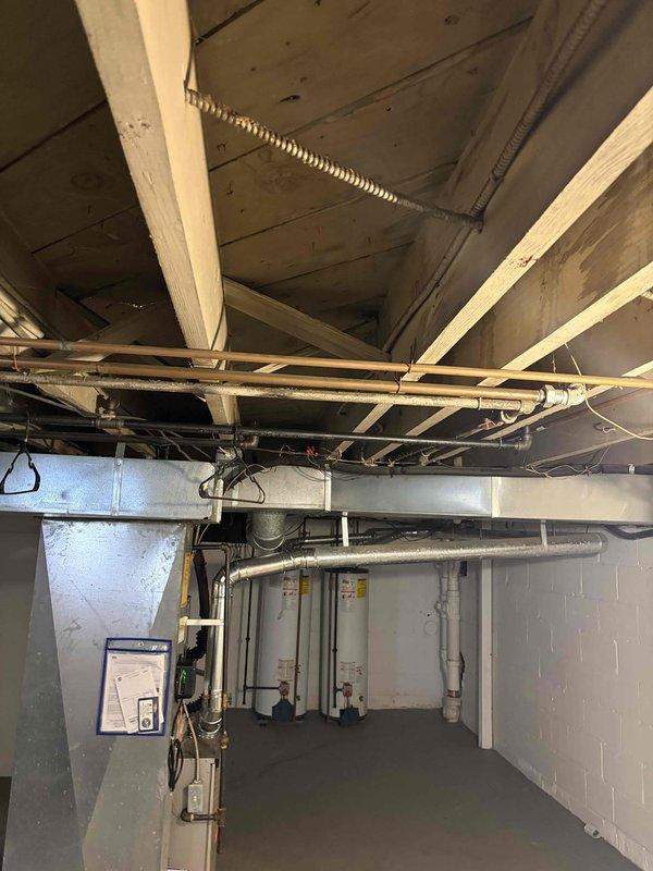 Responded to service call for breakers tripping following recent equipment installation in basement mechanical room. Inspected electrical panel and verified proper connections on all circuit breakers serving newly installed water heating units. Found loose wire connections on 30-amp double-pole breaker supplying power to equipment, which was causing nuisance tripping under load. Tightened all terminal connections to manufacturer specifications, verified proper wire gauge for amperage rating, and tested system operation. Cycled breakers multiple times under load with no further tripping observed. System operating normally at time of departure.