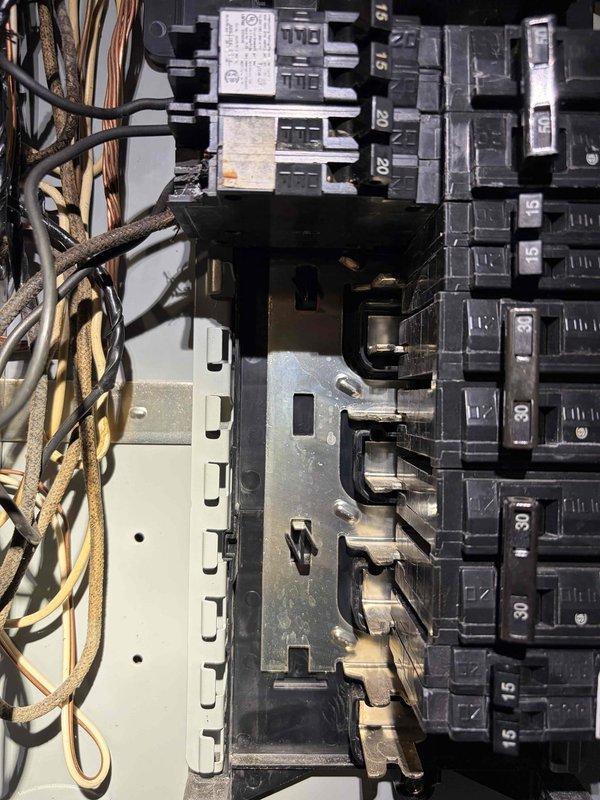 Responded to service call for breakers tripping following recent equipment installation in basement mechanical room. Inspected electrical panel and verified proper connections on all circuit breakers serving newly installed water heating units. Found loose wire connections on 30-amp double-pole breaker supplying power to equipment, which was causing nuisance tripping under load. Tightened all terminal connections to manufacturer specifications, verified proper wire gauge for amperage rating, and tested system operation. Cycled breakers multiple times under load with no further tripping observed. System operating normally at time of departure.