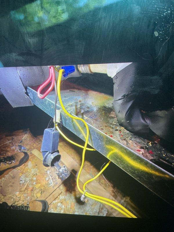 Responded to no-cool call on 17-year-old attic unit that was not turning on. Upon inspection, found humidifier solenoid valve had failed and was causing system lockout. Removed deteriorated humidifier valve assembly showing significant corrosion and mineral buildup on mounting surface and surrounding components. Noted extensive rust staining on cabinet base and biological growth throughout unit interior, consistent with age and attic installation environment. Replaced failed humidifier valve with new assembly, verified proper electrical connections, and restored system operation. Unit cooling normally upon departure.
