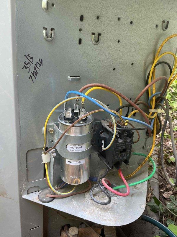 Responded to no-cool call on 10+ year old residential air conditioning unit. Upon arrival, found system humming but not cooling. Performed diagnostic testing with digital multimeter on outdoor condensing unit. Identified failed dual-run capacitor preventing compressor and condenser fan motor from operating properly. Capacitor tested outside acceptable microfarad range. Replaced defective capacitor with OEM-equivalent component, verified all electrical connections, and restored system to proper cooling operation. Unit tested and left running normally.