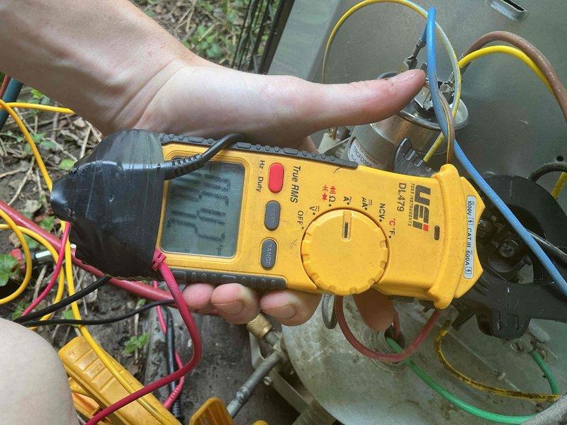 Responded to no-cool call on 10+ year old residential air conditioning unit. Upon arrival, found system humming but not cooling. Performed diagnostic testing with digital multimeter on outdoor condensing unit. Identified failed dual-run capacitor preventing compressor and condenser fan motor from operating properly. Capacitor tested outside acceptable microfarad range. Replaced defective capacitor with OEM-equivalent component, verified all electrical connections, and restored system to proper cooling operation. Unit tested and left running normally.
