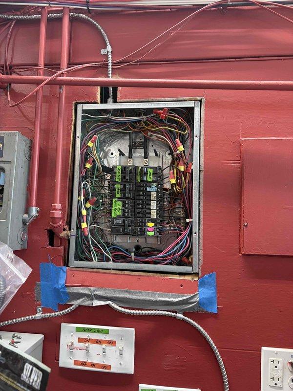 Installed dedicated electrical outlet for ice cream machine at gas station location. Ran new circuit from main electrical panel using flexible metal conduit, installed weatherproof outlet boxes on exterior wall, and terminated connections to accommodate equipment power requirements.