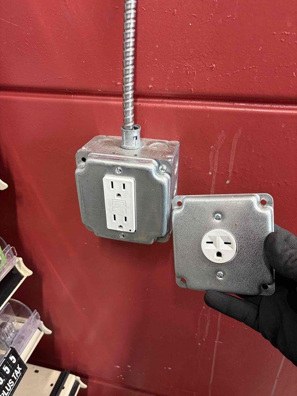 Installed dedicated electrical outlet for ice cream machine at gas station location. Ran new circuit from main electrical panel using flexible metal conduit, installed weatherproof outlet boxes on exterior wall, and terminated connections to accommodate equipment power requirements.
