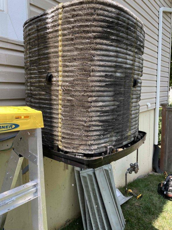 Responded to no cooling complaint on residential air conditioning system. Upon arrival, unit was found in off position. Performed thorough inspection revealing outdoor condenser coil heavily contaminated with dirt, dust, and debris buildup, significantly restricting airflow and reducing heat transfer efficiency. Indoor air filter showed moderate dirt accumulation. Cleaned outdoor coil to restore proper airflow and system performance. Verified system operation and cooling capacity restored to normal parameters.