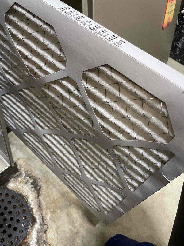 Responded to no cooling complaint on residential air conditioning system. Upon arrival, unit was found in off position. Performed thorough inspection revealing outdoor condenser coil heavily contaminated with dirt, dust, and debris buildup, significantly restricting airflow and reducing heat transfer efficiency. Indoor air filter showed moderate dirt accumulation. Cleaned outdoor coil to restore proper airflow and system performance. Verified system operation and cooling capacity restored to normal parameters.