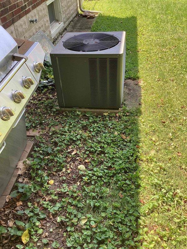 Responded to no cooling complaint where system was struggling to maintain temperature. Upon arrival, found thermostat displaying 75°F setpoint with actual indoor temperature reading 76°F, indicating unit was running but not achieving desired cooling. Inspected outdoor condenser unit located on ground level beside residence in ivy ground cover. Performed diagnostic evaluation of cooling system, checked refrigerant levels, electrical connections, and airflow. System restored to proper operation with indoor temperature brought down to setpoint. Unit tested and verified cooling cycle functioning correctly before departure.