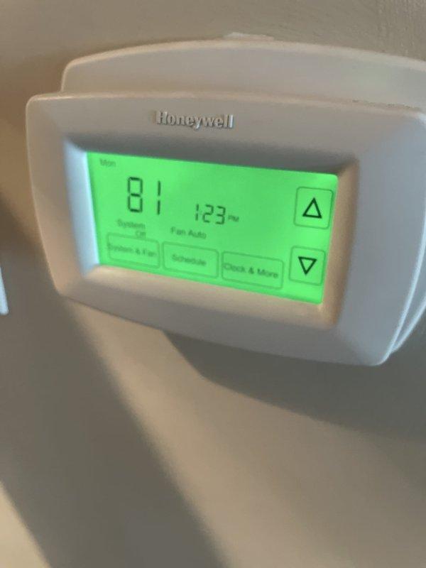 Responded to no-cooling call on 25-year-old residential air conditioning system. Upon arrival, confirmed outside condenser unit was not operating while indoor air handler continued to circulate unconditioned air. Inspected outdoor unit electrical compartment and found heavily soiled components with extensive cobweb accumulation indicating lack of routine maintenance. Tested contactor, capacitor, and compressor functionality. Identified failed dual run capacitor as primary cause of compressor and condenser fan motor failure. Replaced defective capacitor with properly rated component. Cleaned electrical connections and verified proper voltage at all terminals. Cycled system through complete startup sequence and confirmed compressor engaged properly with condenser fan motor operating at correct speed. Measured temperature split at indoor unit showing 18-degree differential, indicating system returned to normal cooling operation. Advised customer of unit's advanced age and recommended cons