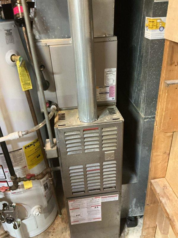 Responded to no cooling call on 10+ year old ground-level outdoor condensing unit located in backyard. Upon arrival, performed diagnostic inspection of both outdoor condenser and indoor air handler/furnace system. Evaluated condenser unit operation, checked refrigerant pressures, inspected electrical components, and verified proper fan motor function. Assessed indoor equipment including blower operation and thermostat communication. System restored to proper cooling operation after completing necessary service procedures.